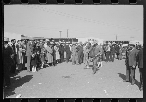 West Texas parading his horse before the judges and spectators at the San Angelo Fat Stock Show, San Angelo, Texas
