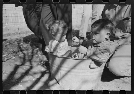 Untitled photo, possibly related to: FSA (Farm Security Administration) Supervisor and a rehabilitation borrower preparing and leveling off the seed bed of a frame garden in a demonstration meeting at San Angelo, Texas