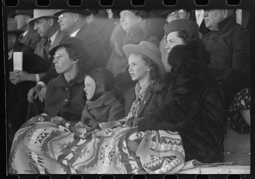 Untitled photo, possibly related to: Spectators at a tense moment during the rodeo at the San Angelo Fat Stock Show, San Angelo, Texas