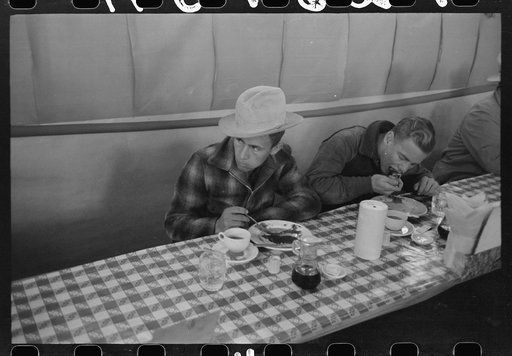 Cowboys eating breakfast at restaurant on the grounds of the San Angelo Fat Stock Show, San Angelo, Texas
