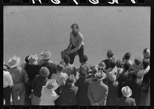 Untitled photo, possibly related to: Rodeo performer riding Brahma bull at the rodeo of the San Angelo Fat Stock Show, San Angelo, Texas
