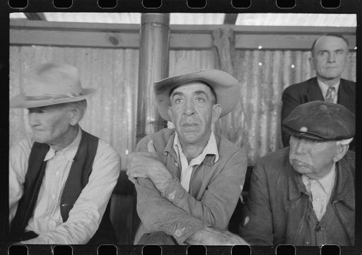 Spectators at stock auction at west Texas stockyards, San Angelo, Texas