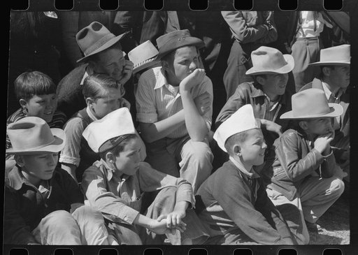 Untitled photo, possibly related to: Group of spectators at sideshow watching man unloosen himself from chains.  San Angelo Fat Stock Show, San Angelo, Texas