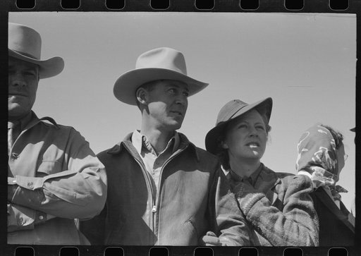 Untitled photo, possibly related to: Group of spectators at sideshow watching man unloosen himself from chains.  San Angelo Fat Stock Show, San Angelo, Texas