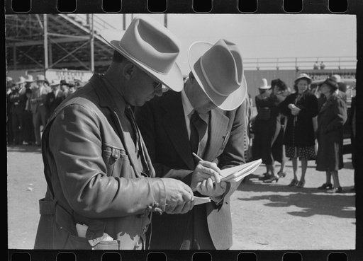 Judges of horses checking the entries at the San Angelo Fat Stock Show, San Angelo, Texas