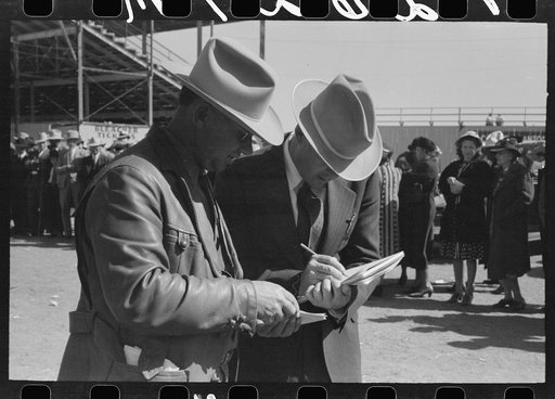 Judges of horses checking the entries at the San Angelo Fat Stock Show