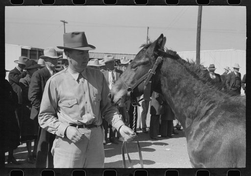 West Texan and his horse which he is displaying in show ring at the San Angelo Fat Stock Show, San Angelo, Texas