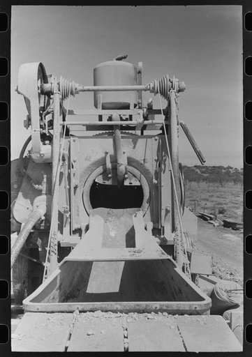 Untitled photo, possibly related to: Concrete mixer at road builders' camp, Menard County, Texas