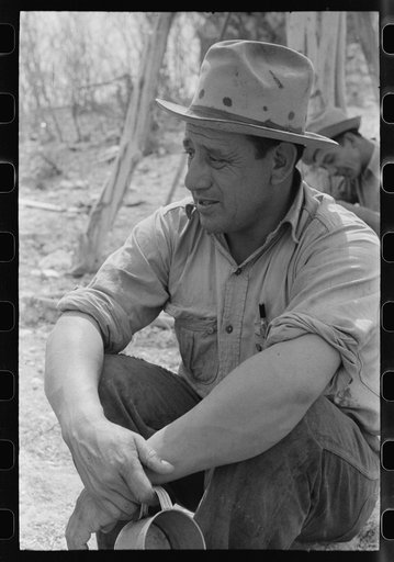 Migratory sheep and goat shearer resting after noonday meal on the ranch of rehabilitation borrower in Kimble County, Texas