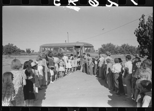 Untitled photo, possibly related to: Children of migratory laborers who are living at migratory labor camp at Agua Fria, Arizona, boarding school bus