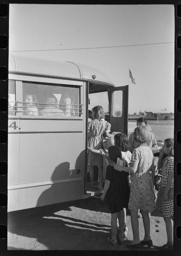 Untitled photo, possibly related to: Children of migratory laborers who are living at migratory labor camp at Agua Fria, Arizona, boarding school bus