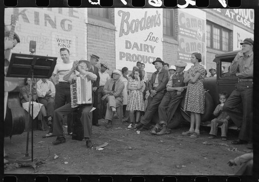 Untitled photo, possibly related to: Orchestra playing outside a grocery store on Saturday afternoon which is designed to attract customers to the store, Phoenix, Arizona