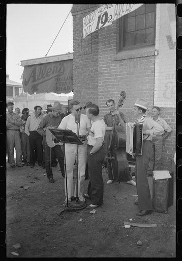 Untitled photo, possibly related to: Orchestra playing outside a grocery store on Saturday afternoon which is designed to attract customers to the store, Phoenix, Arizona