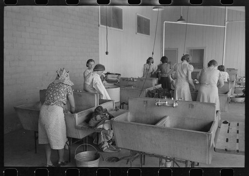 Wash day in the laundry room at the Agua Fria Migratory Labor Camp, Arizona
