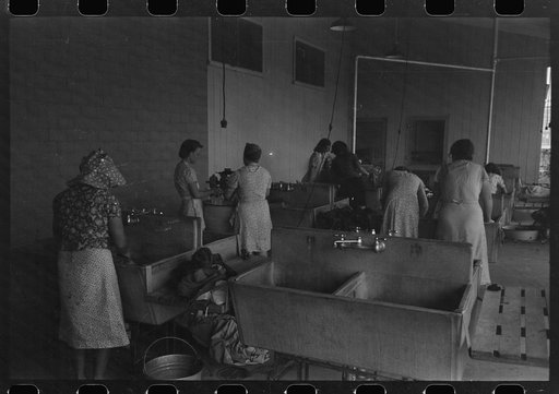 Untitled photo, possibly related to: Wash day in the laundry room at the Agua Fria Migratory Labor Camp, Arizona