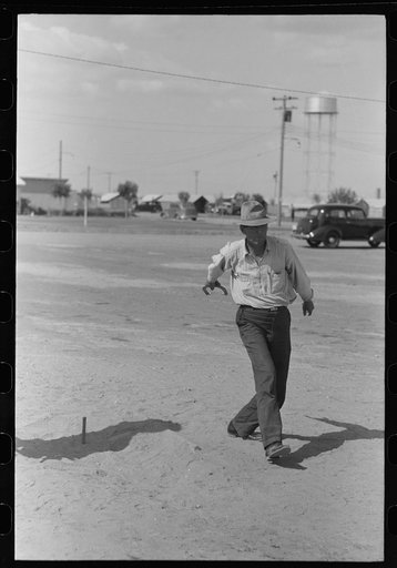Untitled photo, possibly related to: Pitching horseshoes at the Agua Fria Migratory Labor Camp, Arizona