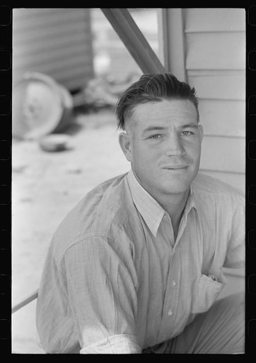 Untitled photo, possibly related to: Migratory laborer cleaning his hat at the Agua Fria Migratory Labor Camp, Arizona