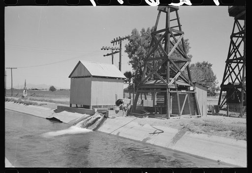 Deep water well that flows into the irrigation ditch. Irrigation is necessary for the raising of all crops in this section, Maricopa County, Arizona