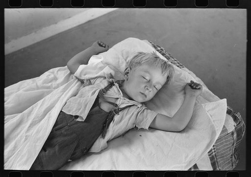 Little boy taking his nap at the Work Projects Administration nursery school at the Casa Grande Valley Farms, Pinal County, Arizona