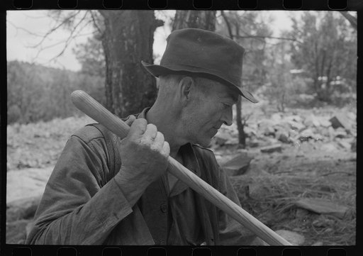 Eugene Davis, gold prospector, Pinos Altos, New Mexico. He says he makes about a dollar a day placer mining and prefers it to five dollars a day in town