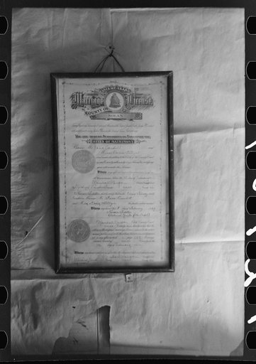 Untitled photo, possibly related to: Marriage license hanging on homesteader's wall, Pie Town, New Mexico