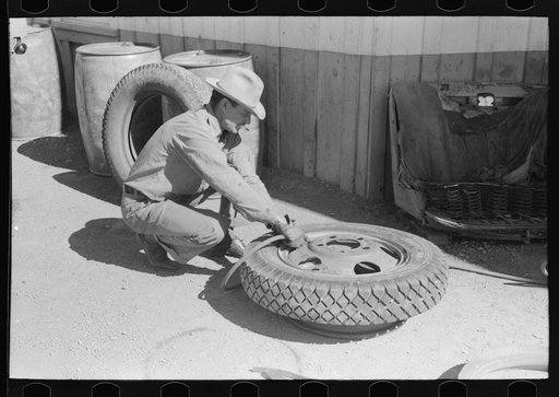 Changing tire at the garage. Pie Town, New Mexico