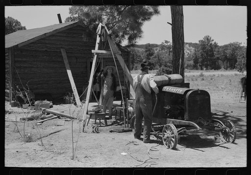 Farmer and his wife drilling water well with cable tools, Pie Town, New Mexico