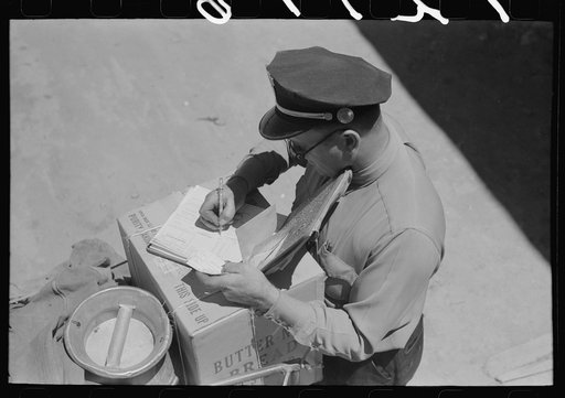 Stage driver making out express receipt. Pie Town, New Mexico