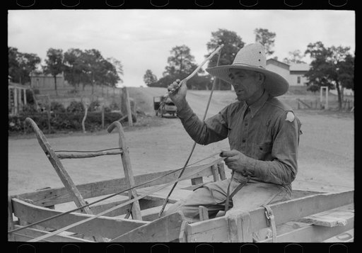 Mr. Leatherman starting for home in his burro-drawn cart. The handles of the cart belong to a homemade terracing implement belonging to Mr. Craig who loaned it to Leatherman to do his terracing. Pie Town, New Mexico