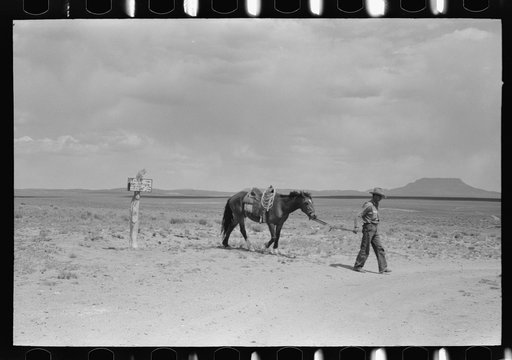 Cowboy with Spanish cowpony. Pie Town, New Mexico