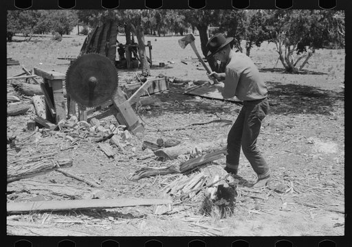 Untitled photo, possibly related to: Farmer chopping wood. Pie Town, New Mexico