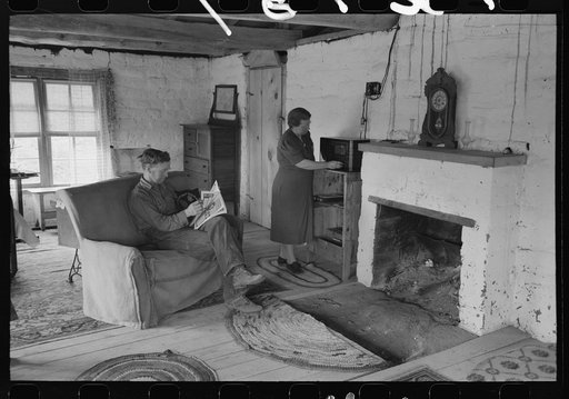 Untitled photo, possibly related to: Homesteader and his wife in the living room of their new adobe house. This couple came out seven years ago from Oklahoma and lived in a log cabin until building this winter the adobe house. Pie Town, New Mexico