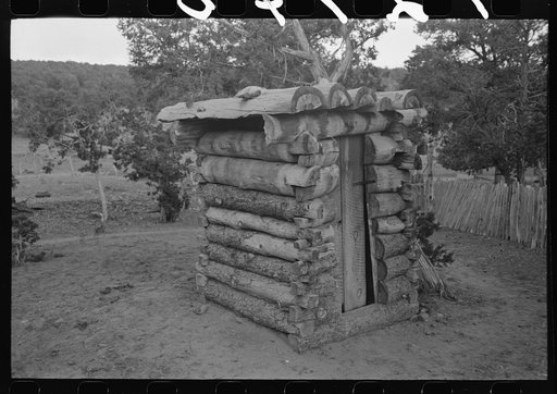 Untitled photo, possibly related to: Log privy on homesteader's farm. Pie Town, New Mexico