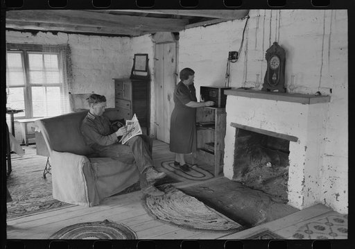 Untitled photo, possibly related to: Homesteader and his wife in the living room of their new adobe house. This couple came out seven years ago from Oklahoma and lived in a log cabin until building this winter the adobe house. Pie Town, New Mexico