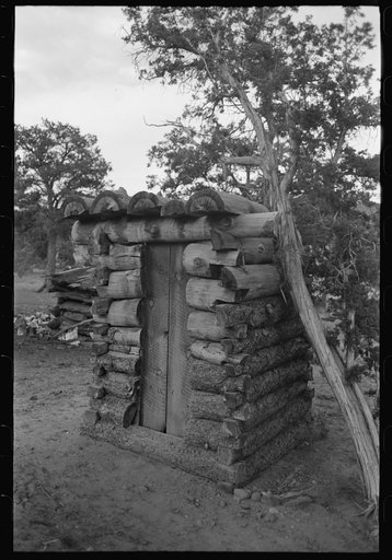 Log privy on homesteader's farm. Pie Town, New Mexico