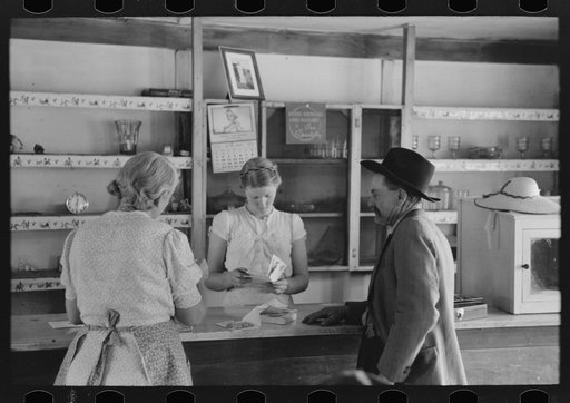 Louis Stagg who runs the cafe and her mother looking at greeting cards which the salesman has. Pie Town, New Mexico