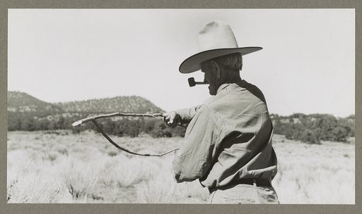 Water witch. Green forked stick is held firmly thus. Pie Town, New Mexico