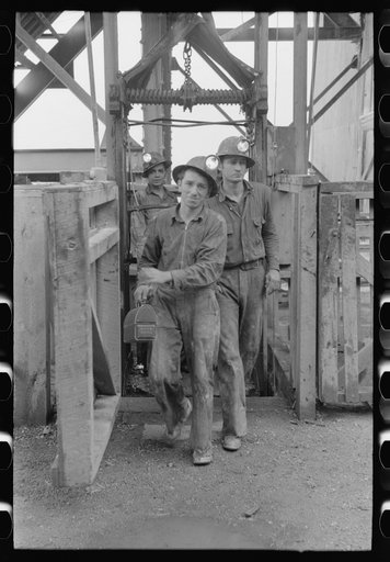 Workers in gold mine coming out of cage which brings them to the surface at the end of the day's work. Mogollon, New Mexico