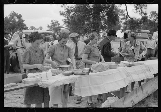 Putting out the food for dinner at community sing. Pie Town, New Mexico