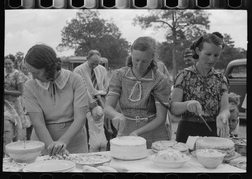 Cutting cakes, dinner of all day community sing. Pie Town, New Mexico