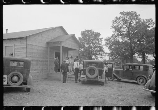 Untitled photo, possibly related to: In front of the church during the community sing. Notice the milk can which holds drinking water. Pie Town, New Mexico