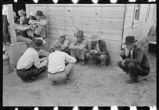 Untitled photo, possibly related to: In front of the church during the community sing. Notice the milk can which holds drinking water. Pie Town, New Mexico