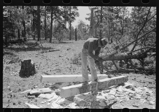 Hewing out a tie with a broadaxe, Pie Town, New Mexico
