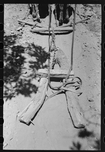 Homemade vehicle to which ties are strapped for hauling down the mountain, Pie Town, New Mexico