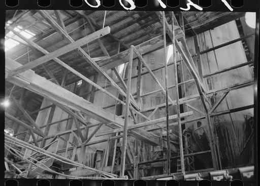 Untitled photo, possibly related to: Large tanks used for mixing powdered gold ore with cyanide solution to extract gold and silver, gold mine, Mogollon, New Mexico