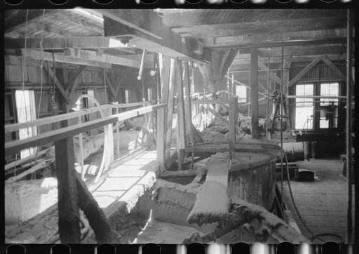 Large tanks used for mixing powdered gold ore with cyanide solution to extract gold and silver. Gold mine at Mogollon, New Mexico