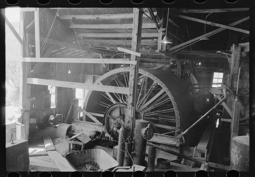 Rotary vacuum filter used for removing cyanide solution containing gold from the tailings. Gold mine at Mogollon, New Mexico