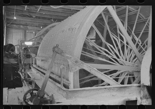 Untitled photo, possibly related to: Rotary vacuum filter used for removing cyanide solution containing gold from the tailings. Gold mine at Mogollon, New Mexico