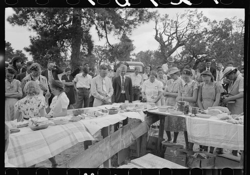 The blessing at dinner at the grounds at the all day community sing. Pie Town, New Mexico