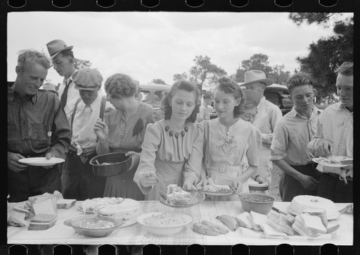 Helping the plates at dinner on the grounds, all day community sing. Pie Town, New Mexico